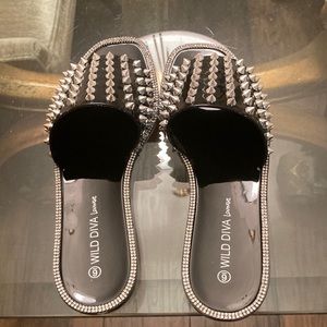 Black, flat, plastic  sandals with spike studs, and rhinestones